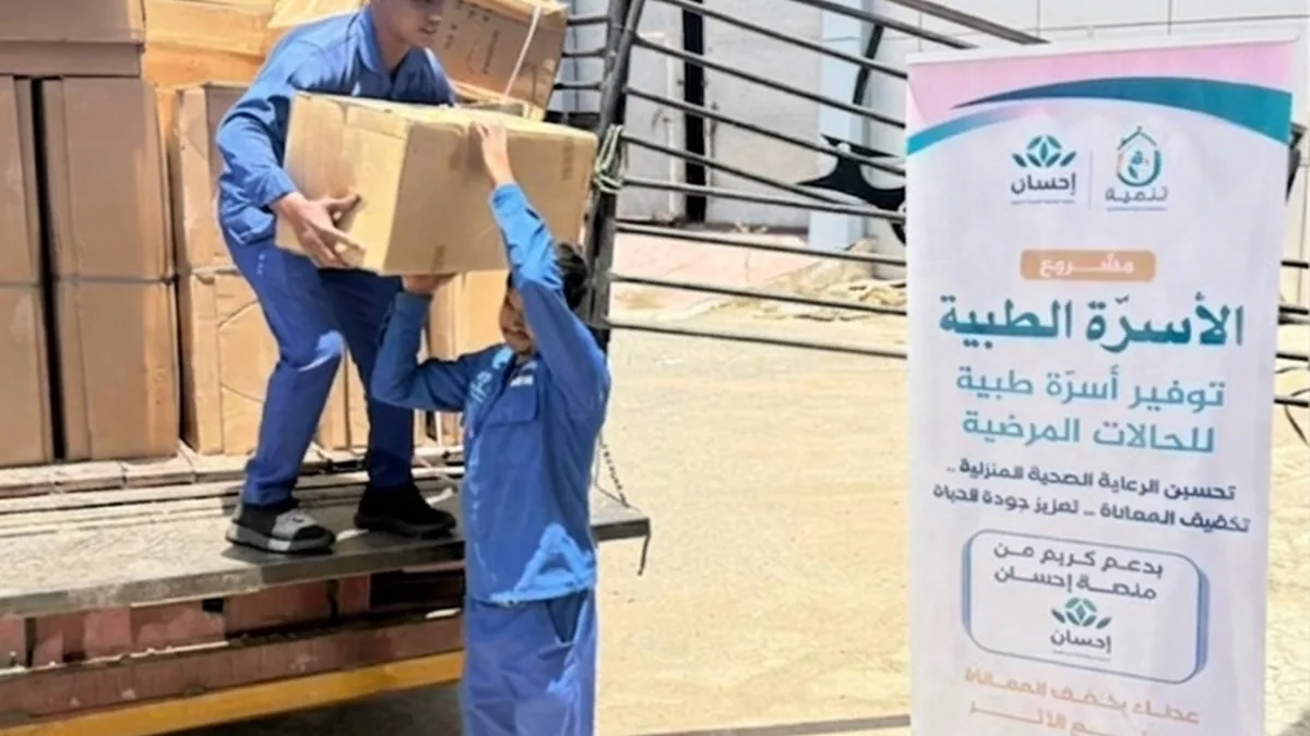 The association's team unloading the shipment of medical beds for patients cared for at home